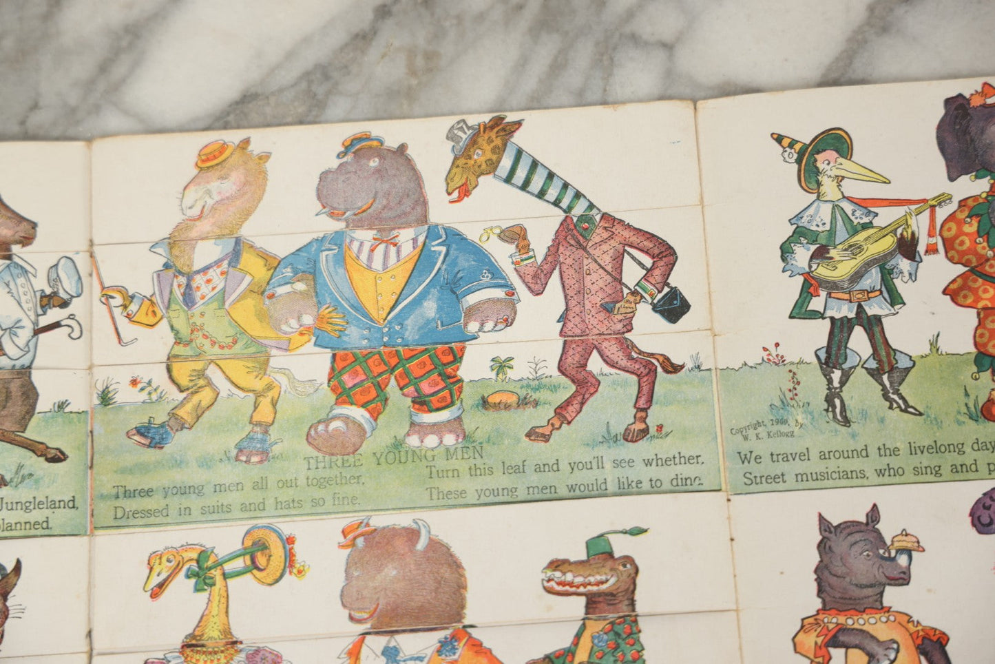 Lot 047 - Antique Kellogg's Cereal Advertising Book, "Funny Jungleland Moving Pictures" With Anthropomorphic Animals, Pages Flip To MIX And Match Heads, Outfits, Bodies, Copyright 1909 By W.K. Kellogg, Battle Creek, Michigan 