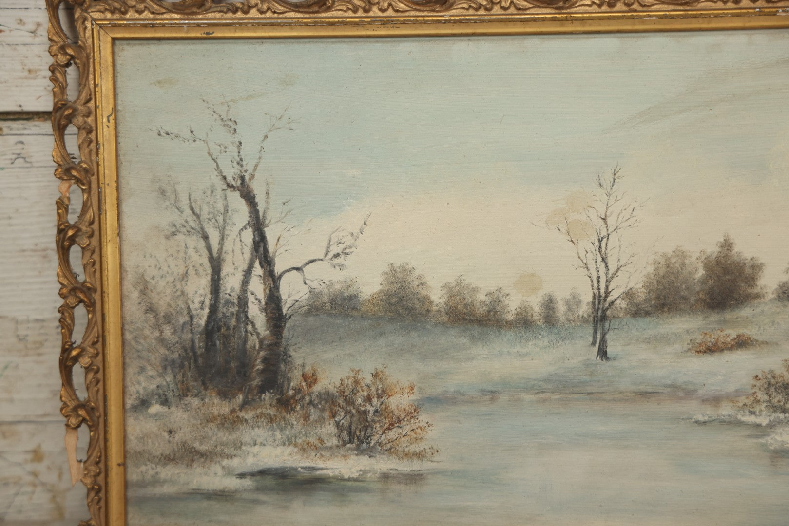 Lot 054 - Antique Oil On Board Landscape Painting Depicting Winter Scene With Trees And River Scene In Gilt Frame, 22-1/8" x 11-5/8"