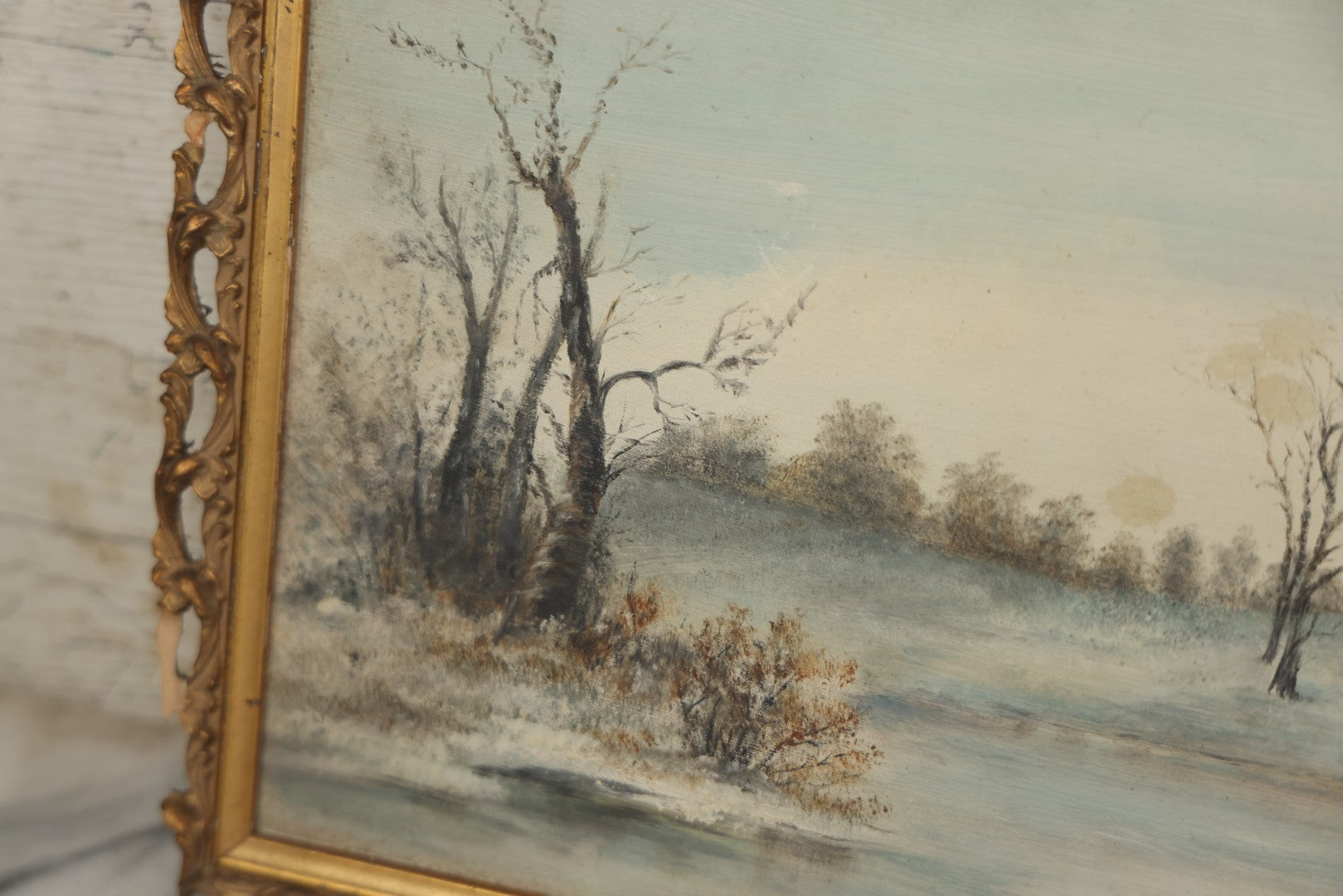Lot 054 - Antique Oil On Board Landscape Painting Depicting Winter Scene With Trees And River Scene In Gilt Frame, 22-1/8" x 11-5/8"