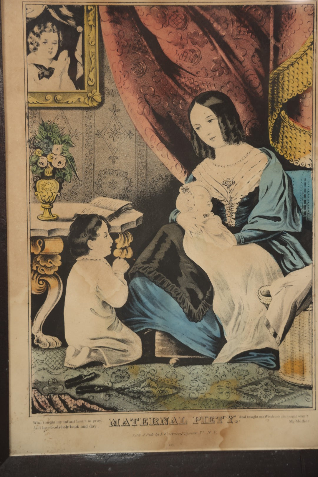 Lot 056 - Antique Hand-Colored Lithograph "Maternal Piety" By N. Currier, Young Mother With Baby And Child At Prayer, In Period Frame, 12-3/4" x 16-3/4"