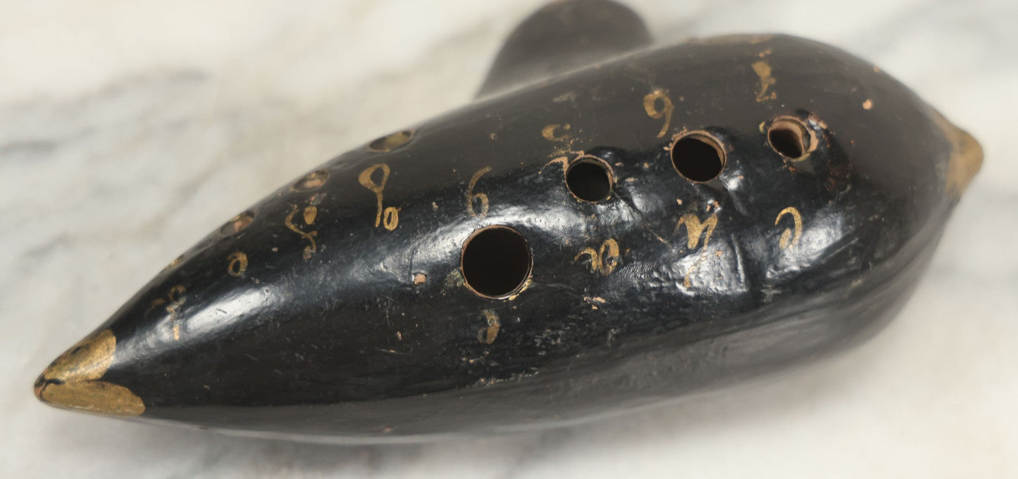 Lot 066 - Vintage Black Lacquered Clay Ocarina Wind Instrument, Made In Vienna, Austria, With Gold Painted Details, Stamped Maker's Mark
