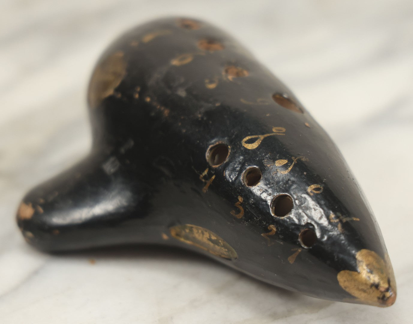 Lot 066 - Vintage Black Lacquered Clay Ocarina Wind Instrument, Made In Vienna, Austria, With Gold Painted Details, Stamped Maker's Mark