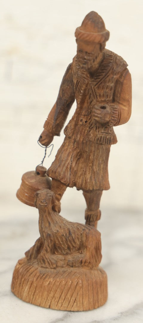 Lot 069 - Antique Folk Art Hand Carved Wooden Man Holding Lamp, With Goat At His Feet.