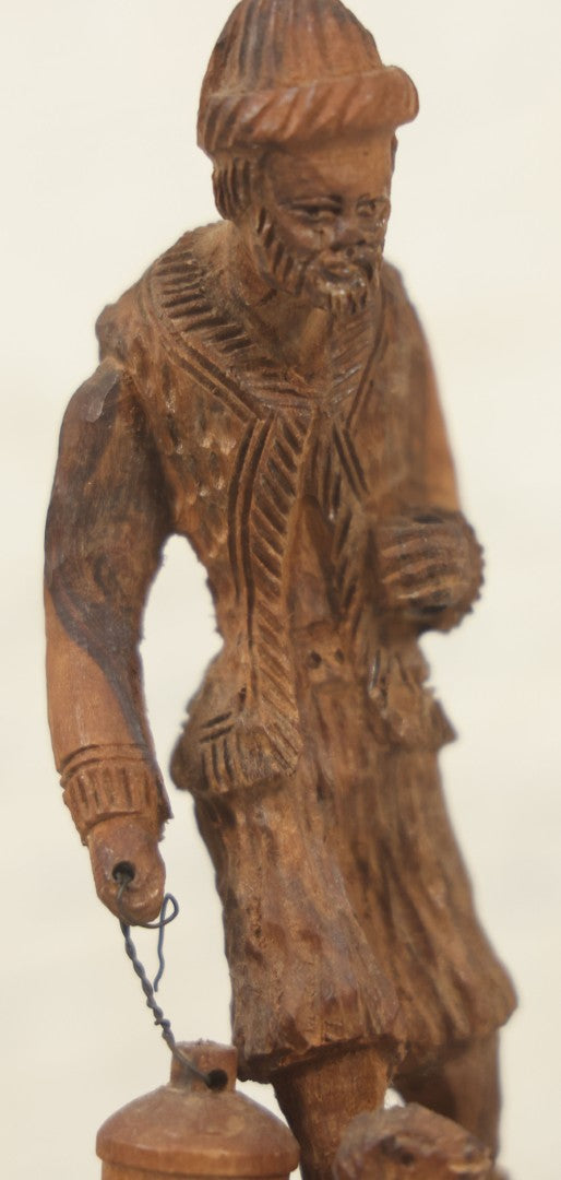 Lot 069 - Antique Folk Art Hand Carved Wooden Man Holding Lamp, With Goat At His Feet.