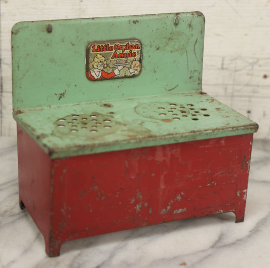 Lot 081 - Vintage Little Orphan Annie Tin Lithograph Toy Stove With Red And Green Paint, Circa 1930s Note Surface Wear And Rust