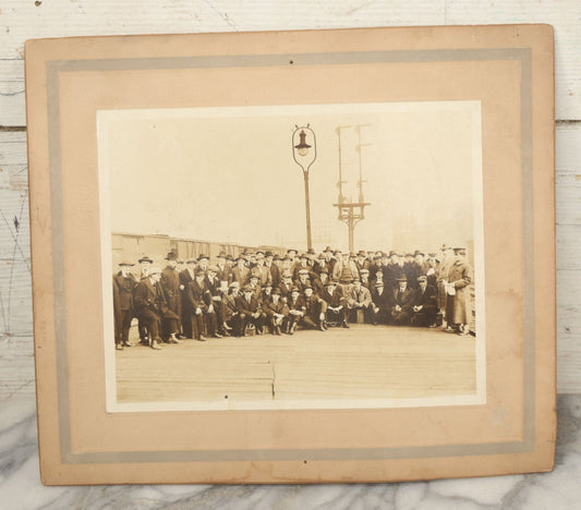 Lot 092 - Antique Boarded Photograph Of Group Of Men In Suits And Hats Posing In Front Of An Illinois Central Railroad Train, Note Warped
