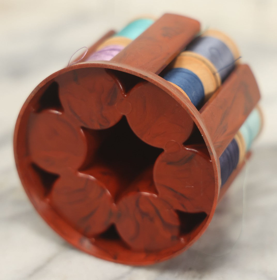 Lot 107 - Antique And Vintage Sewing Lot Including Marbled Plastic Thread Holder With Pin Cushion, Metal Mushroom Thread Holder, Two Thimbles, And Cast Iron Table Clamp Thread Holder By Herter's, Waseca Minn., No. 29