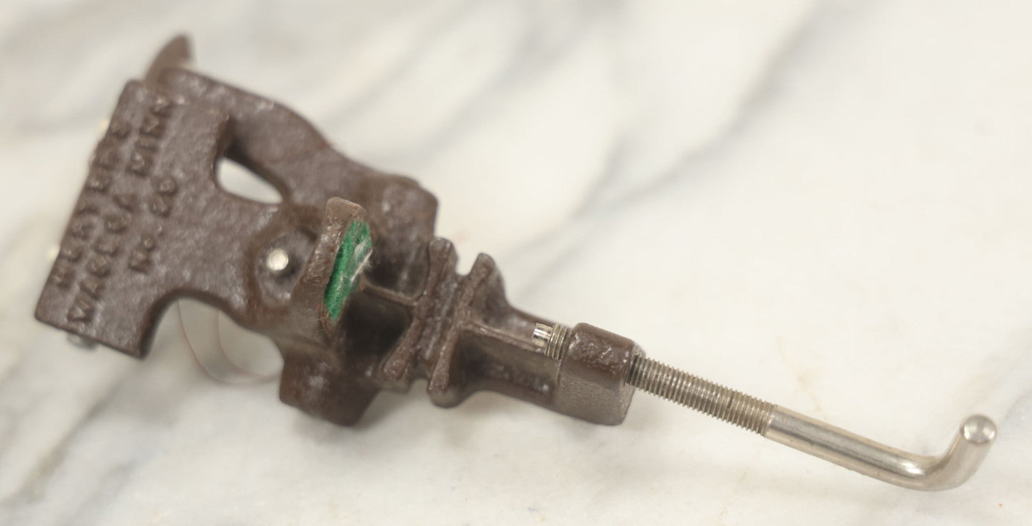 Lot 107 - Antique And Vintage Sewing Lot Including Marbled Plastic Thread Holder With Pin Cushion, Metal Mushroom Thread Holder, Two Thimbles, And Cast Iron Table Clamp Thread Holder By Herter's, Waseca Minn., No. 29