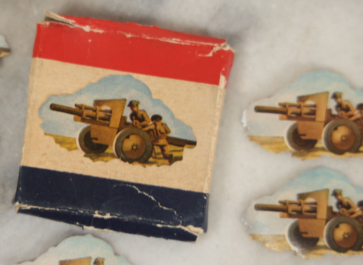 Lot 112 - Box Of Dennison World War I Era Seals With Soldiers Operating Artillery, 5 Of 30 Remaining, Box Damaged