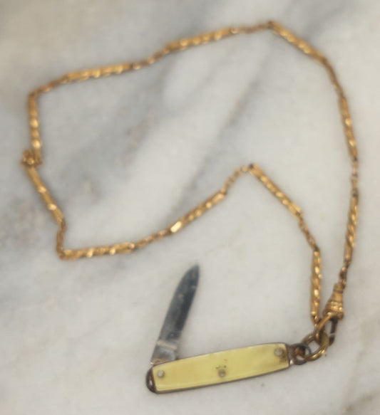 Lot 124 - Vintage Miniature Pocket Knife Marked “Made In U.S.A.” On Wrist Chain Marked “Radio”