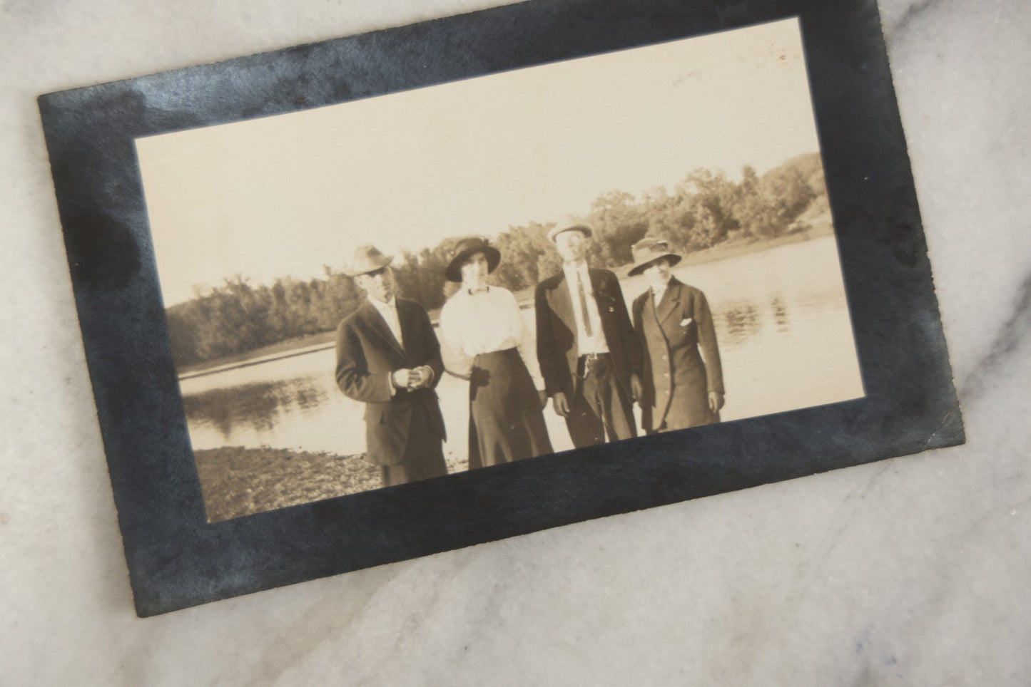 Lot 169 - Grouping Of 12 Antique Real Photo Postcards R.P.P.C., Including Cards Featuring Well Dressed Men And Women, Posing On Dock, In Field, With Babies