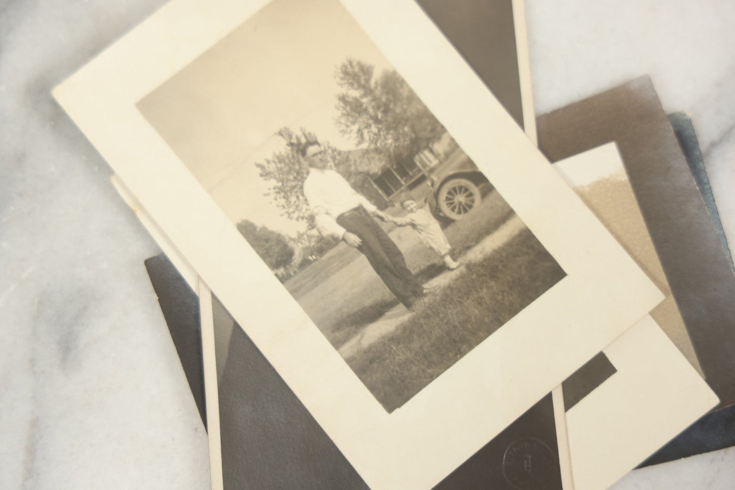 Lot 169 - Grouping Of 12 Antique Real Photo Postcards R.P.P.C., Including Cards Featuring Well Dressed Men And Women, Posing On Dock, In Field, With Babies