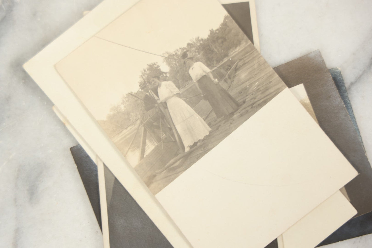 Lot 169 - Grouping Of 12 Antique Real Photo Postcards R.P.P.C., Including Cards Featuring Well Dressed Men And Women, Posing On Dock, In Field, With Babies