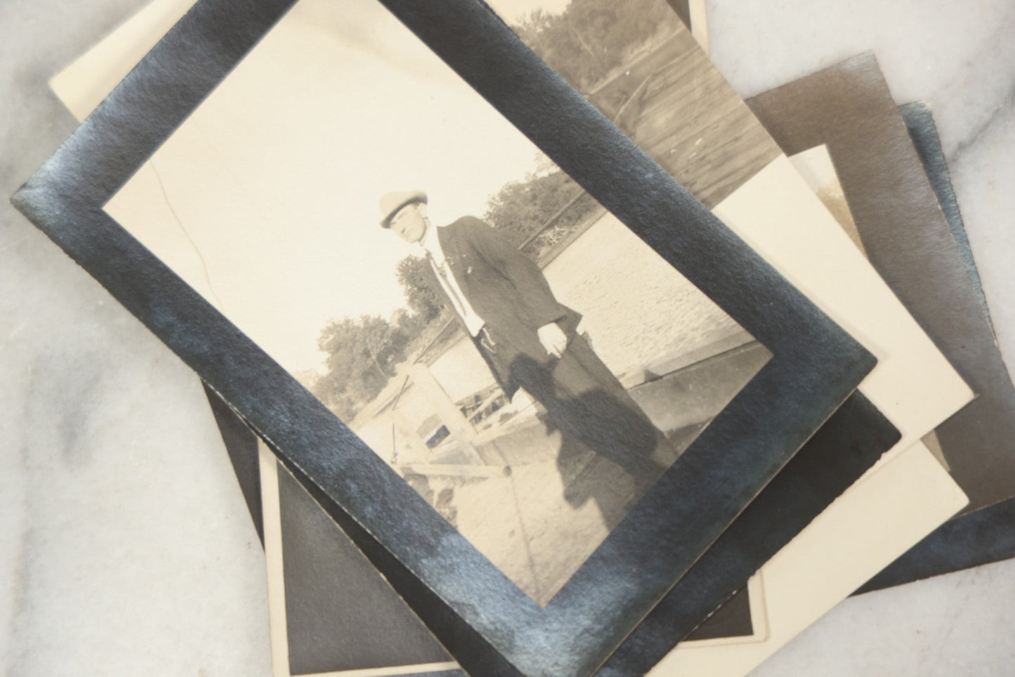 Lot 169 - Grouping Of 12 Antique Real Photo Postcards R.P.P.C., Including Cards Featuring Well Dressed Men And Women, Posing On Dock, In Field, With Babies
