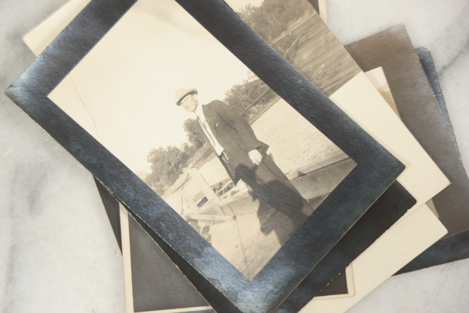 Lot 169 - Grouping Of 12 Antique Real Photo Postcards R.P.P.C., Including Cards Featuring Well Dressed Men And Women, Posing On Dock, In Field, With Babies