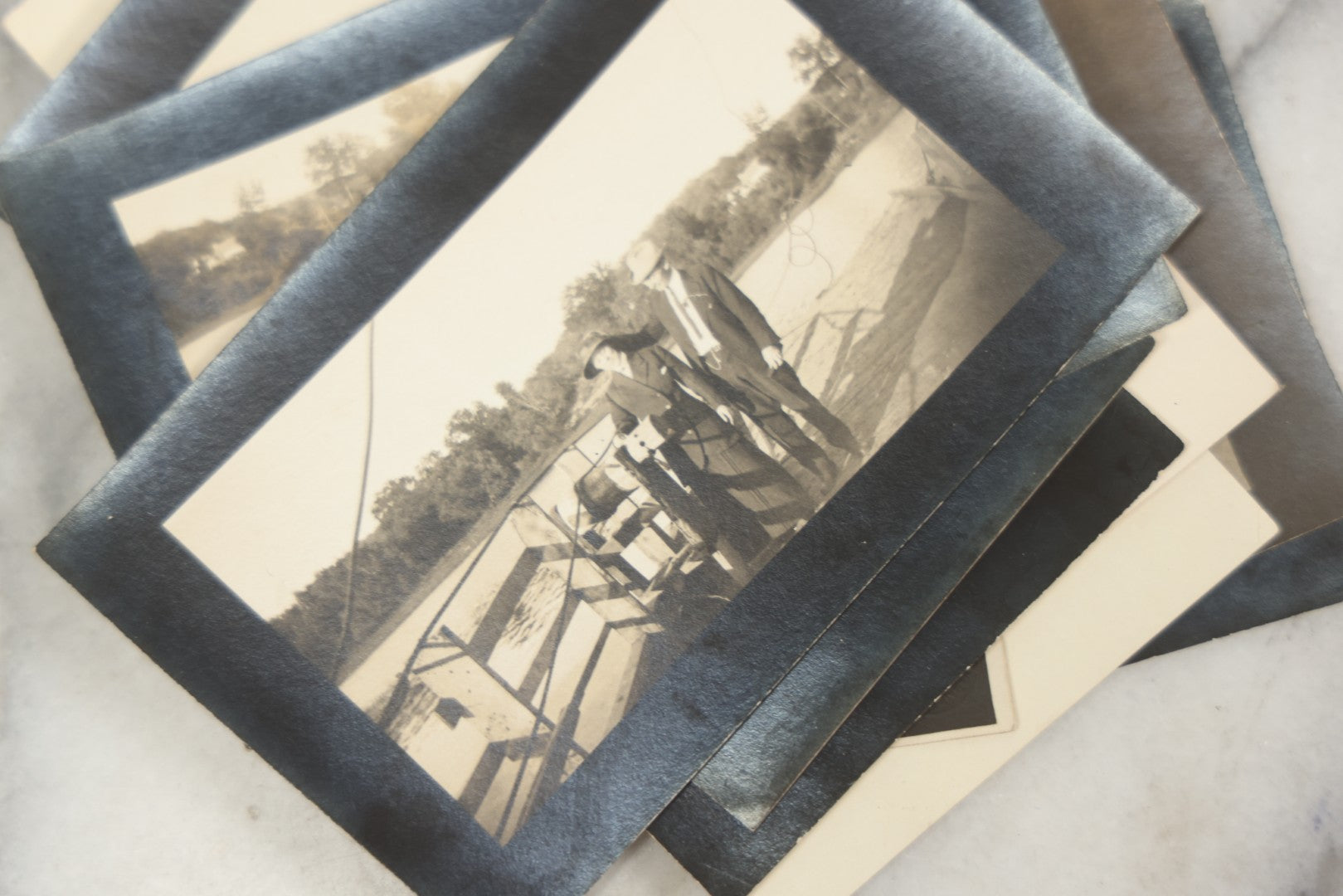 Lot 169 - Grouping Of 12 Antique Real Photo Postcards R.P.P.C., Including Cards Featuring Well Dressed Men And Women, Posing On Dock, In Field, With Babies