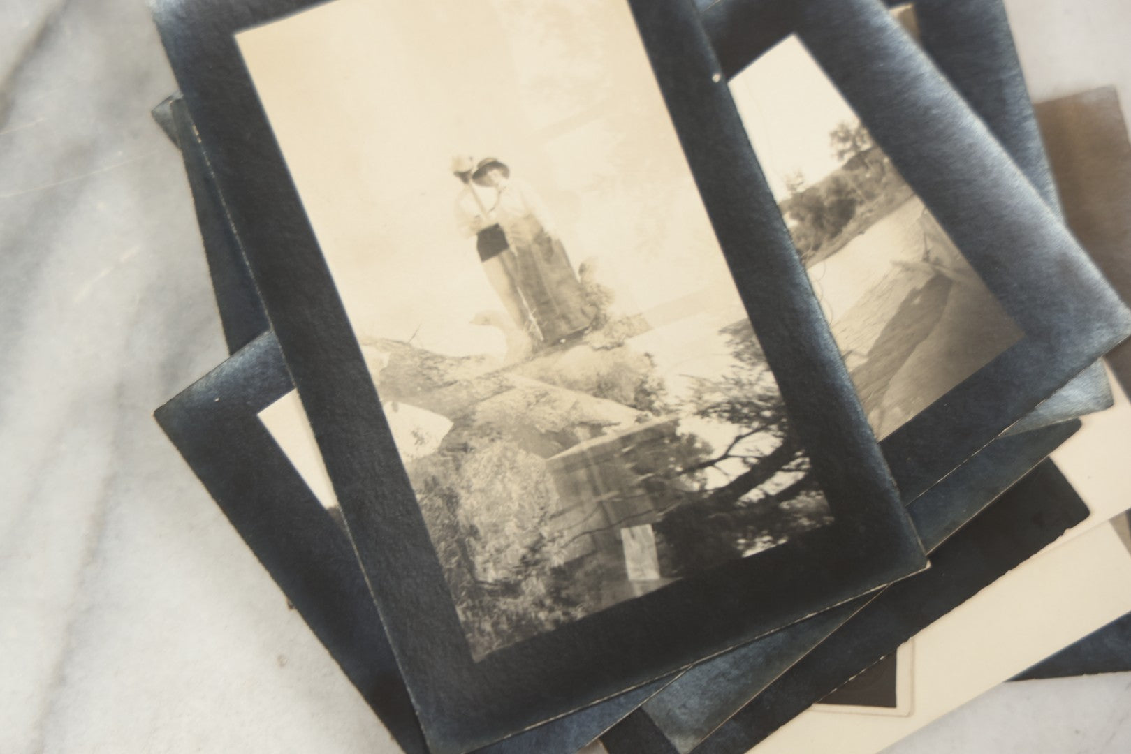 Lot 169 - Grouping Of 12 Antique Real Photo Postcards R.P.P.C., Including Cards Featuring Well Dressed Men And Women, Posing On Dock, In Field, With Babies