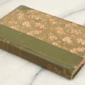 Lot 177 - "The Dolly Dialogues" By Anthony Hope, Undated, Publisher Unknown, Circa 1900s Flower Print And Illustrations On Spine, Pocket Sized