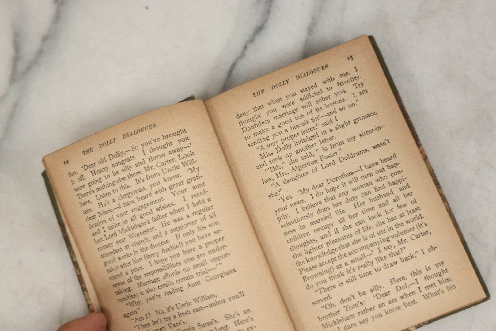 Lot 177 - "The Dolly Dialogues" By Anthony Hope, Undated, Publisher Unknown, Circa 1900s Flower Print And Illustrations On Spine, Pocket Sized