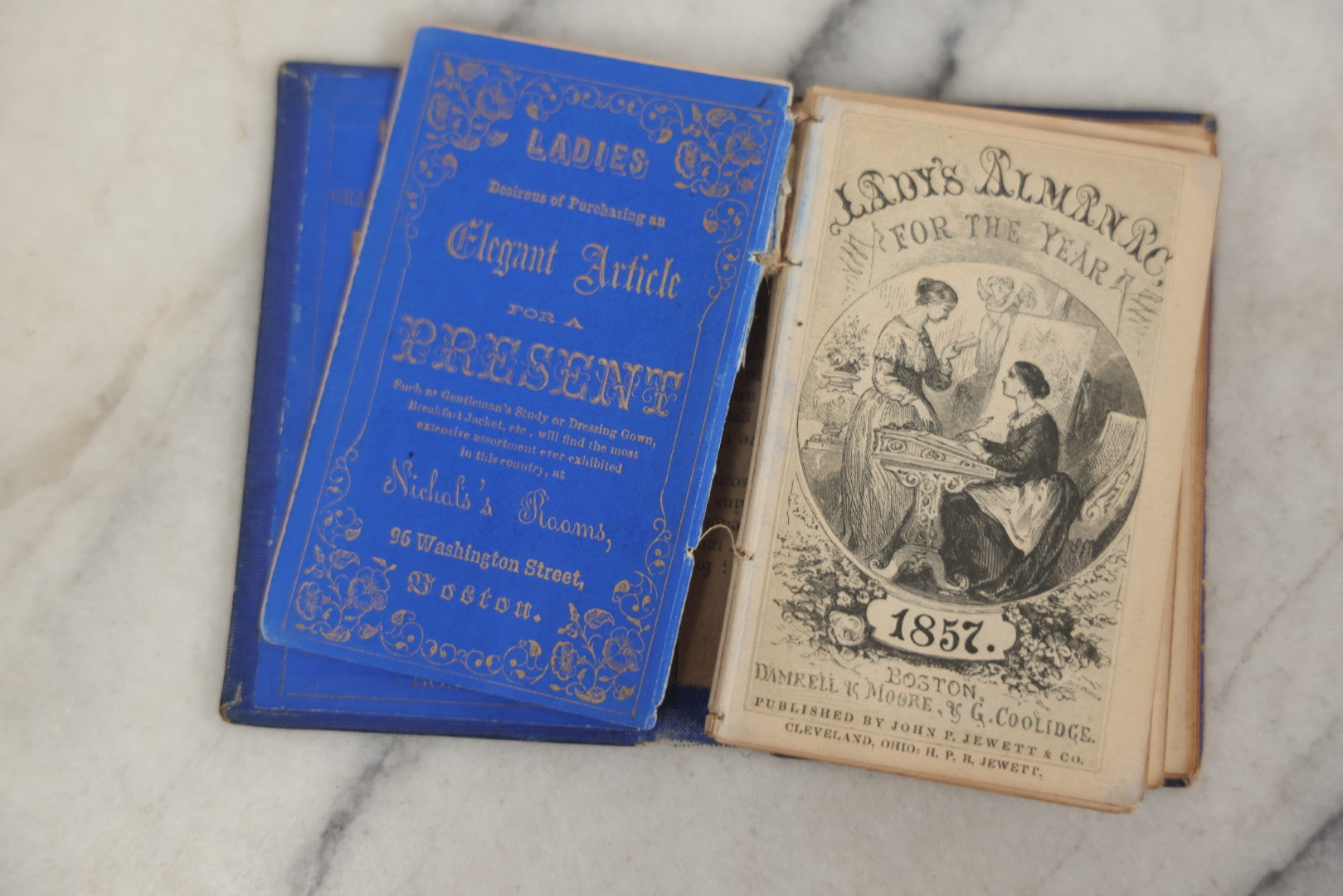 Lot 180 - Pair Of Antique Pocket Almanac Books, Including "Lady's Almanac For The Year 1857" With Brilliant Blue Full Page Advertisements, And "The Boston Almanac" For 1848 With Fold-Out Map Of Boston
