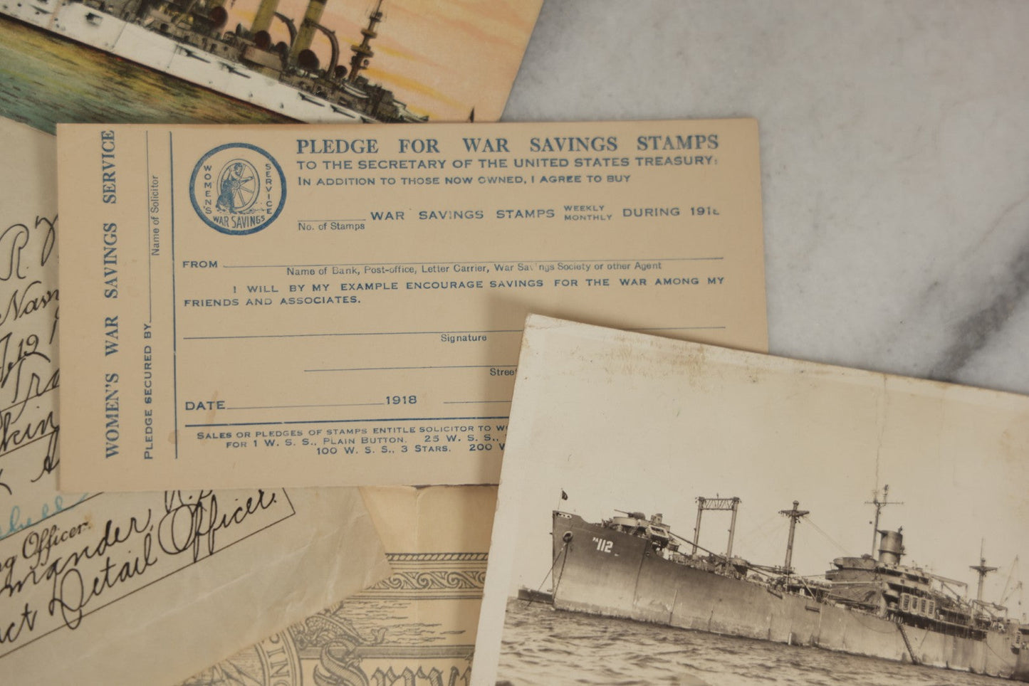 Lot 190 - Grouping Of Seven Antique World War I Related Ephemera Items Including Discharge Papers For John Joseph Breen And Michael J. Breen, Comic Postcard, And War Savings Stamps Forms, Circa 1910s–1920s