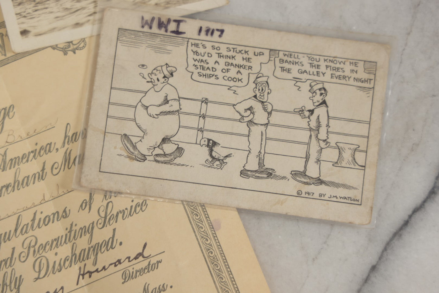 Lot 190 - Grouping Of Seven Antique World War I Related Ephemera Items Including Discharge Papers For John Joseph Breen And Michael J. Breen, Comic Postcard, And War Savings Stamps Forms, Circa 1910s–1920s