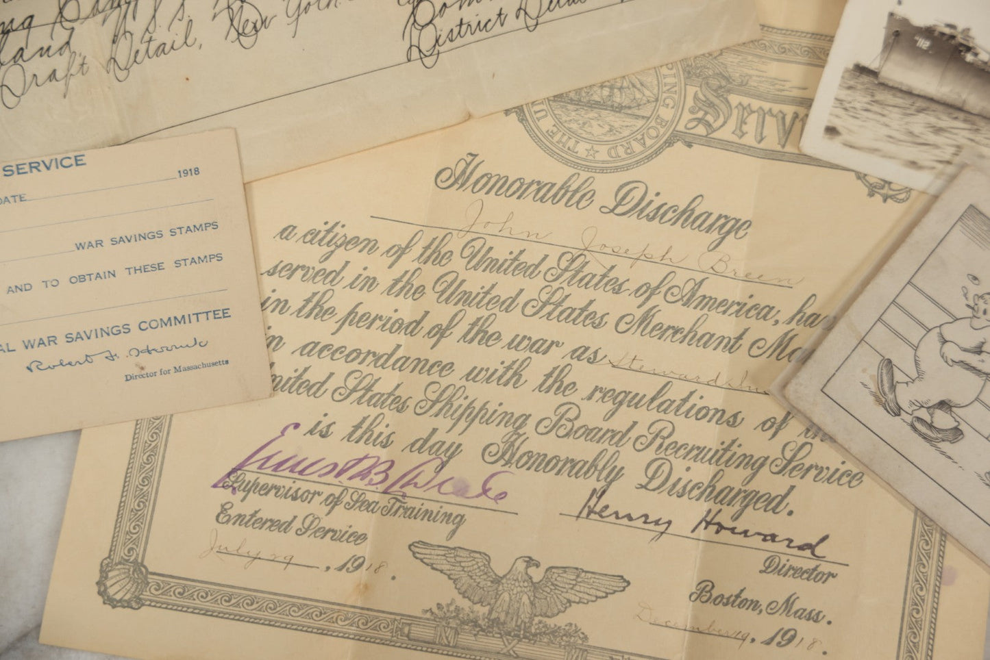 Lot 190 - Grouping Of Seven Antique World War I Related Ephemera Items Including Discharge Papers For John Joseph Breen And Michael J. Breen, Comic Postcard, And War Savings Stamps Forms, Circa 1910s–1920s