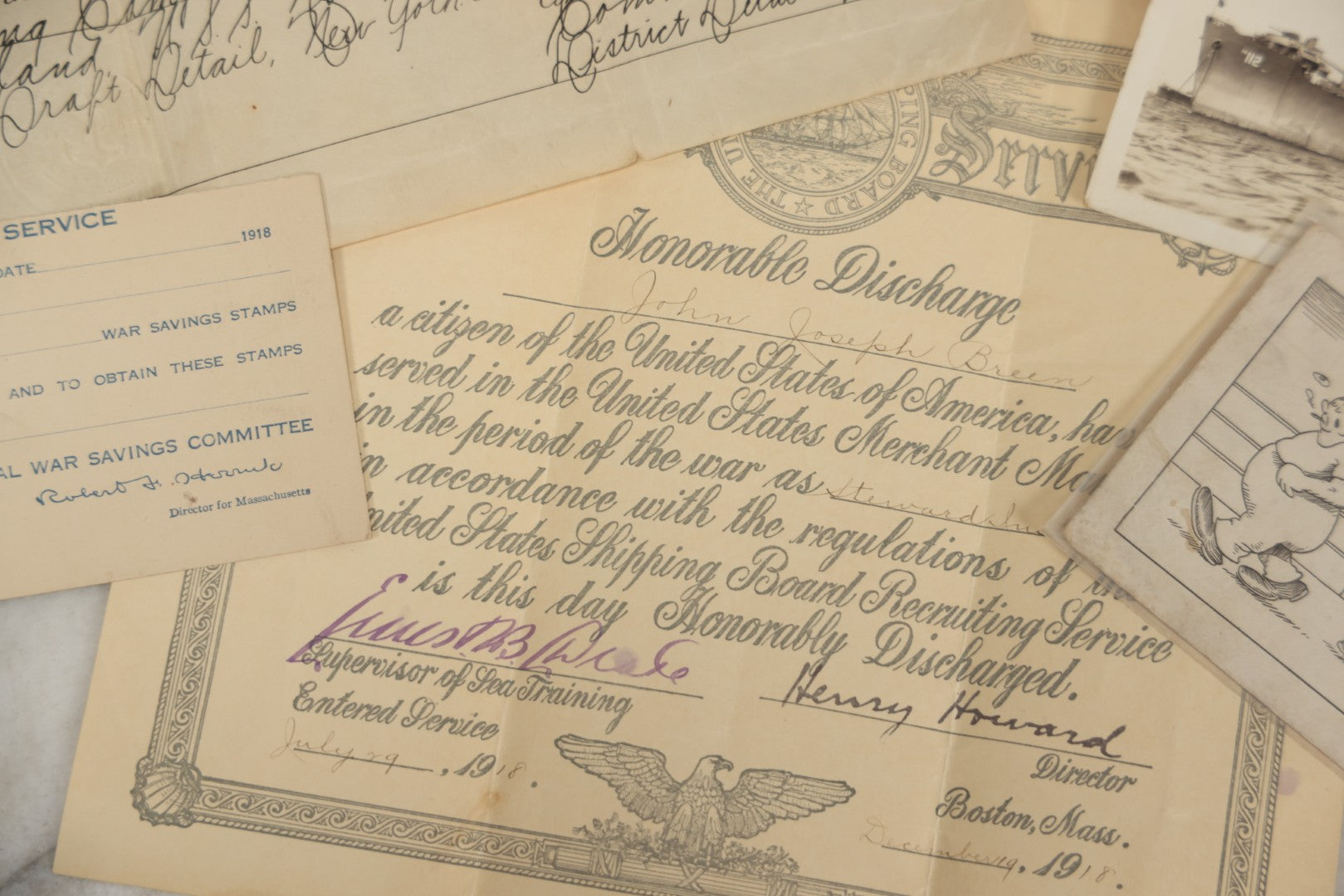 Lot 190 - Grouping Of Seven Antique World War I Related Ephemera Items Including Discharge Papers For John Joseph Breen And Michael J. Breen, Comic Postcard, And War Savings Stamps Forms, Circa 1910s–1920s