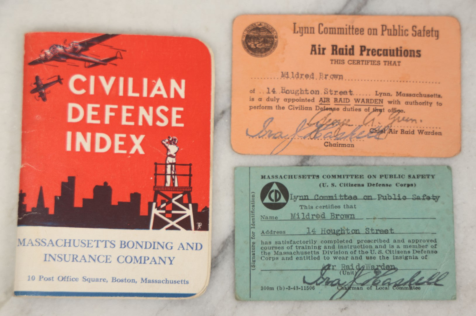 Lot 193 - Grouping Of Four Vintage World War II Civil Defense Ephemera Items, Including Air Raid Drill Letter (June 5, 1944), Civilian Defense Index Booklet, Lynn Air Raid Precautions Warden Card, And Identification Card For Mildred Brown