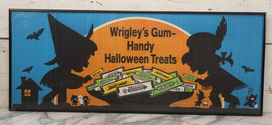 Lot 001 - Vintage Wrigley's Gum “Handy Halloween Treats” Crimped Paper Advertisement, Silhouetted Children In Costume, Blue, Orange & Black Colors, In Modern Metal Frame
