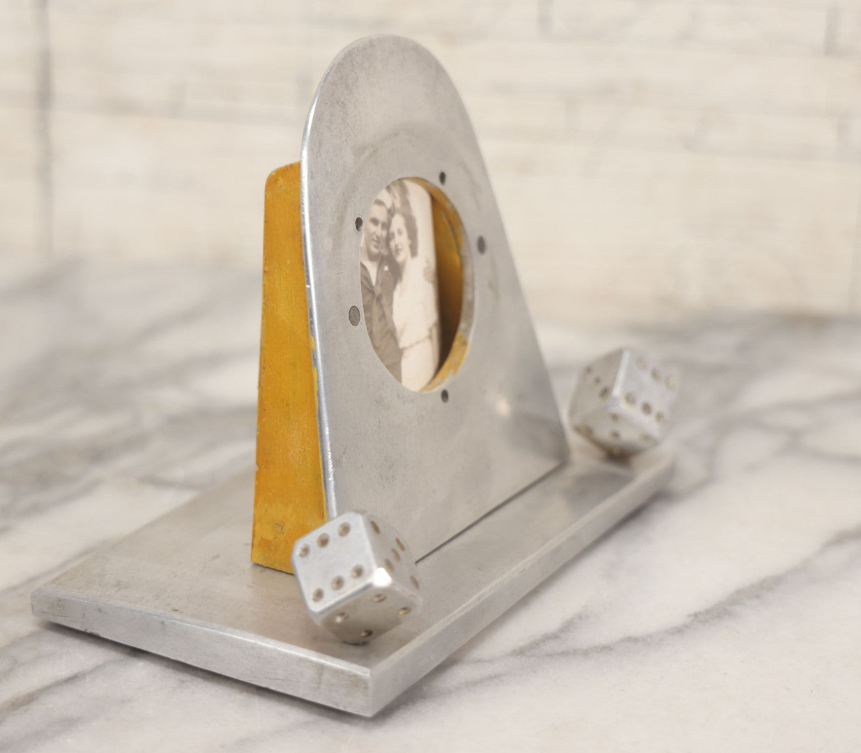 Lot 005 - Vintage Machined Aluminum Photo Frame With Brushed Finish, With Balancing Dice, Navy Sweetheart Snapshot Photograph