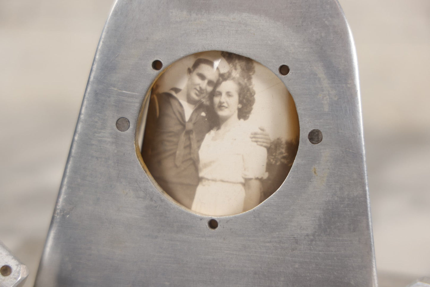 Lot 005 - Vintage Machined Aluminum Photo Frame With Brushed Finish, With Balancing Dice, Navy Sweetheart Snapshot Photograph