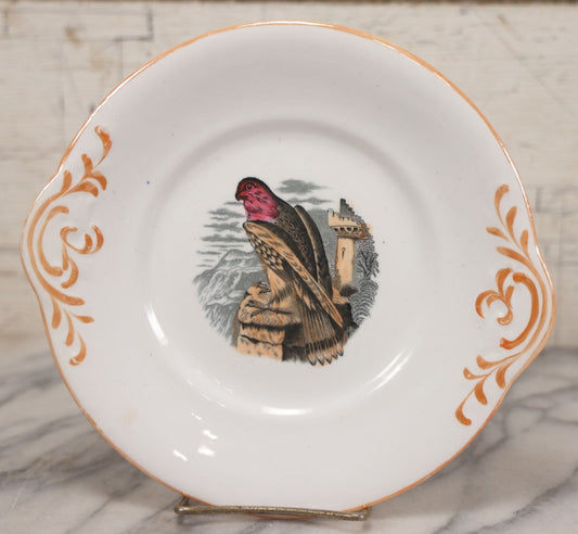 Lot 014 - Antique Hand Colored Transferware Plate With Falcon And Castle, Pink And Orange Coloring, Metallic Orange Painted Design On Handles And Rim, Unmarked, 9-1/8" Diameter
