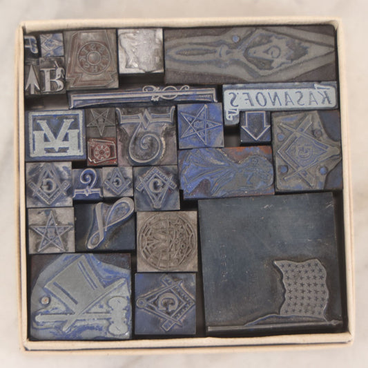 Lot 015 - Grouping Of Vintage Printing Blocks With Masonic Or Fraternal Symbols, Letters, Arrows, 48 Star Flag, In Unmarked Box As Found