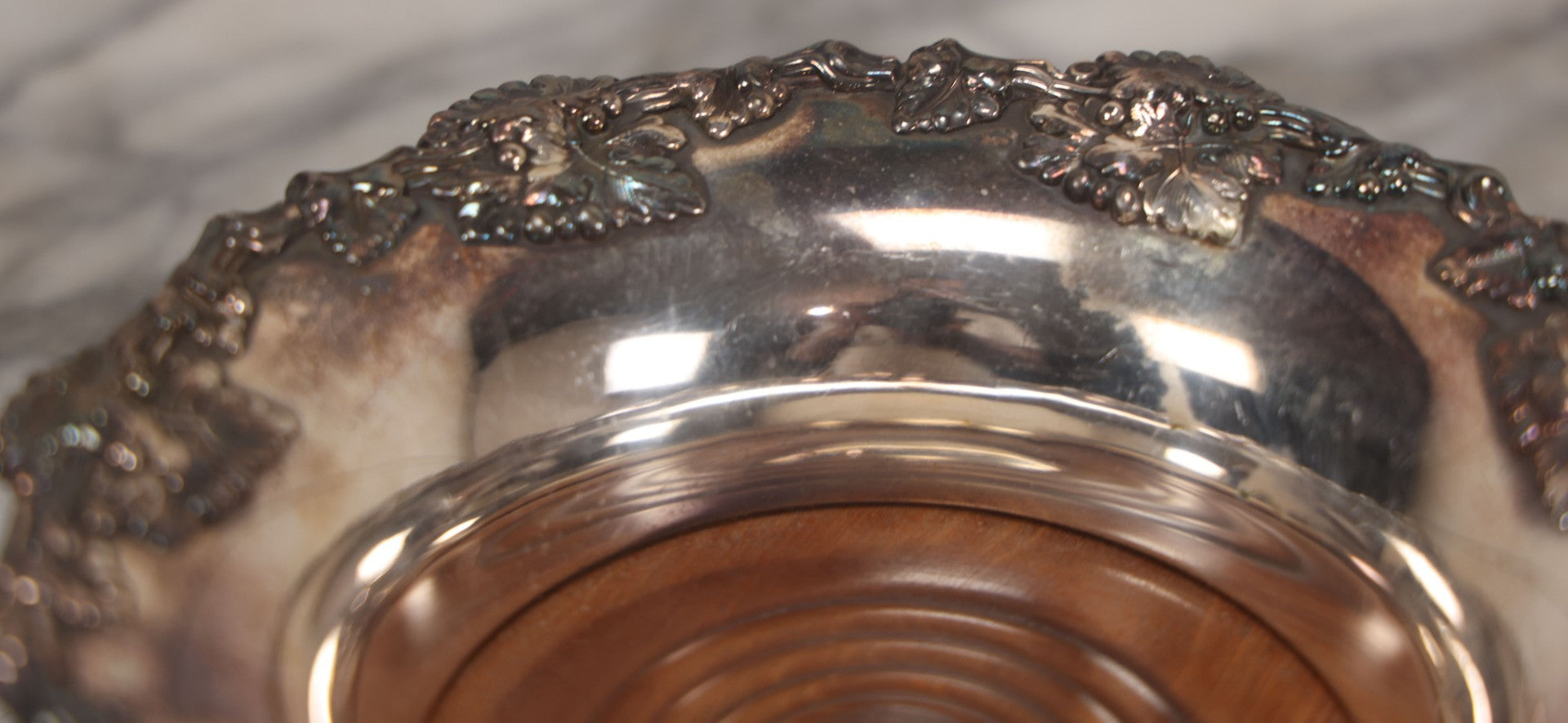 Lot 019 - Vintage Silverplate Dish With Turned Wood Base, Felt Bottom, Grape Leaf And Vine Motif Around Rim, 8" Diameter