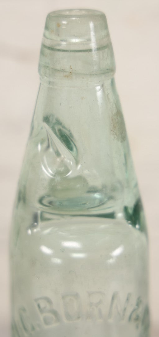 Lot 020 - Antique Codd-Neck Bottle With Raised Lettering "H.C. Born & Co Military Road Colchester," Trapped Glass Ball, 9" H