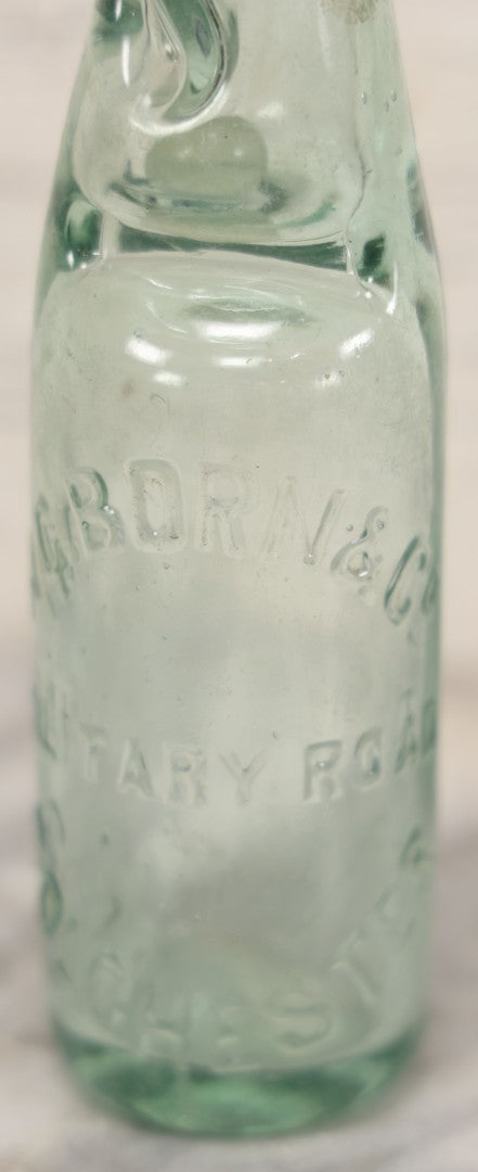 Lot 020 - Antique Codd-Neck Bottle With Raised Lettering "H.C. Born & Co Military Road Colchester," Trapped Glass Ball, 9" H