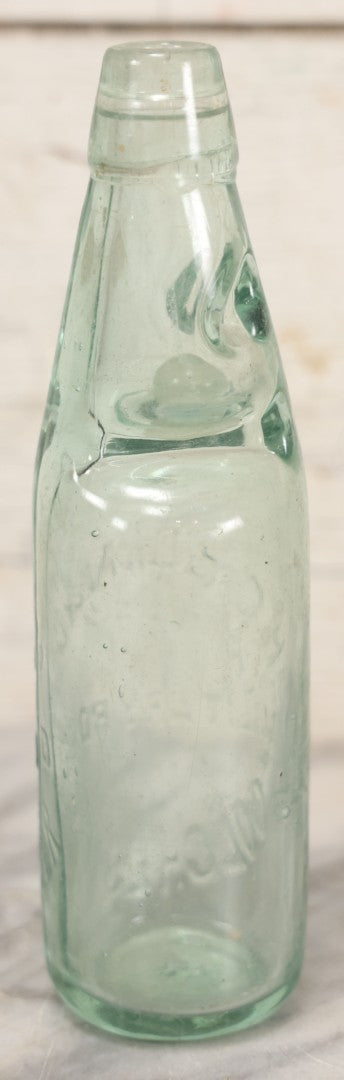 Lot 020 - Antique Codd-Neck Bottle With Raised Lettering "H.C. Born & Co Military Road Colchester," Trapped Glass Ball, 9" H