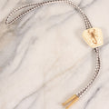 Lot 034 - Vintage Scorpion In Lucite Bolo Tie With White And Brown Cord And White-Backed Pendant