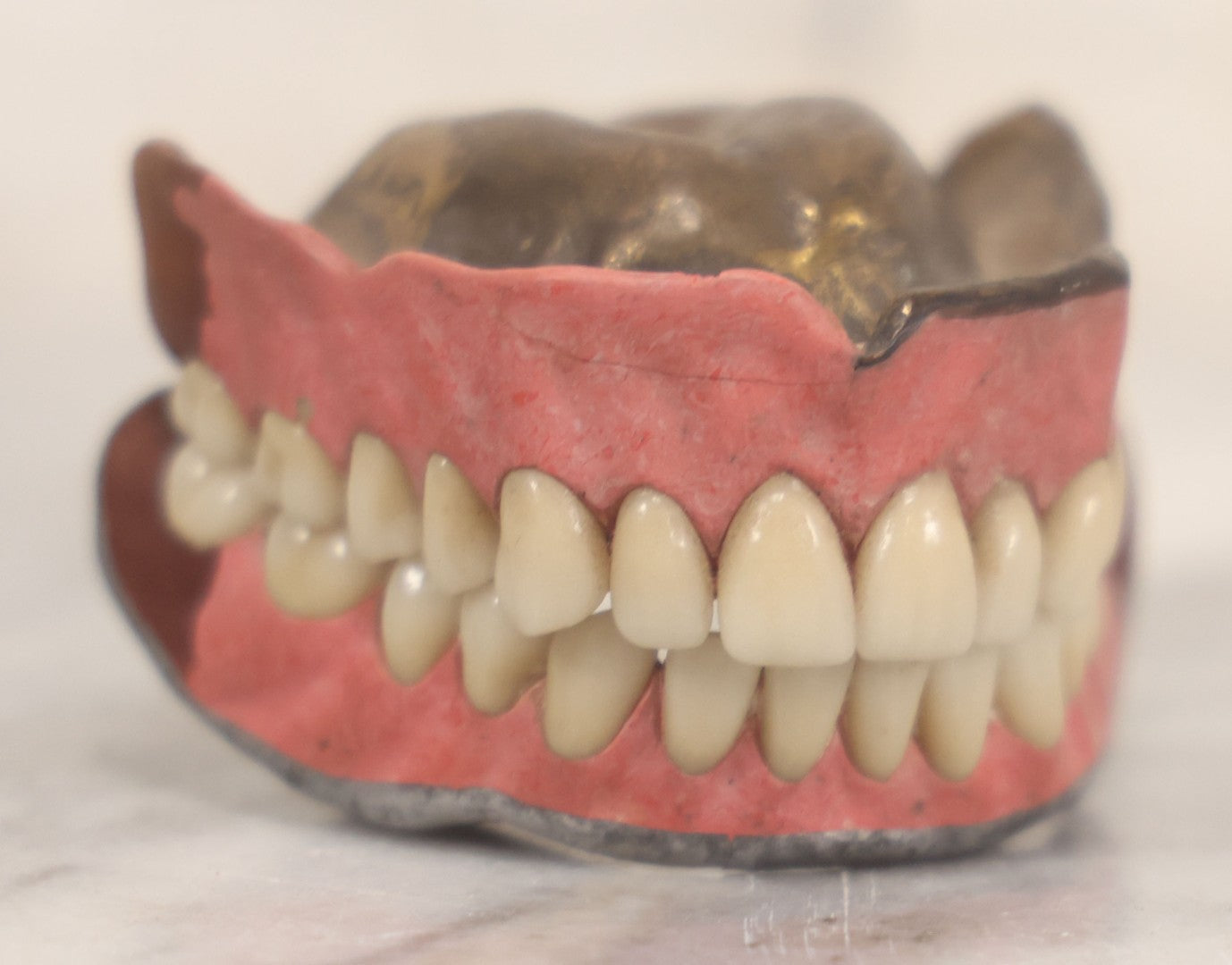 Lot 038 - Pair Of Vintage Dentures With Resin Teeth On Metal Dental Plate