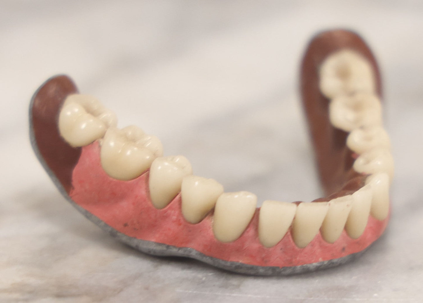 Lot 038 - Pair Of Vintage Dentures With Resin Teeth On Metal Dental Plate