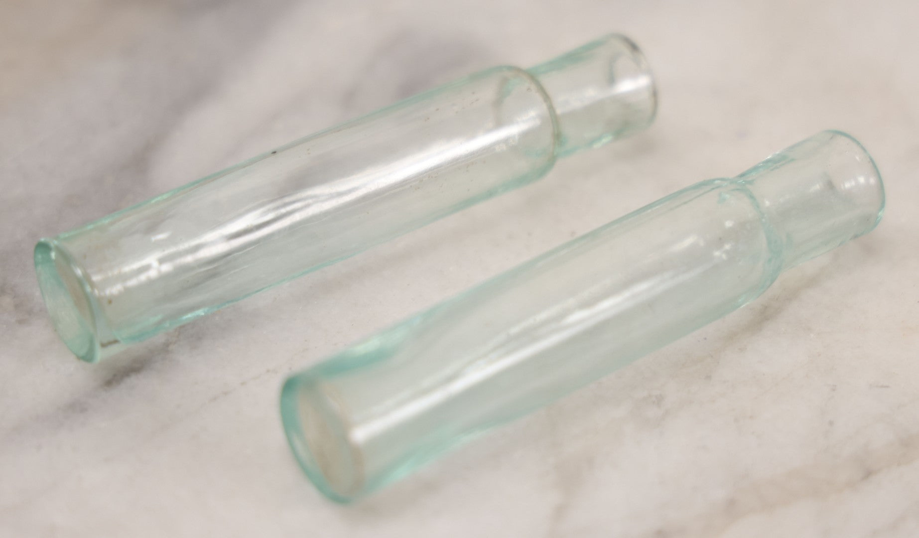 Lot 041 - Grouping Of Two Miniature Narrow Clear Glass Bottles And "Confessions Of An Opium Eater" Antique Miniature Book With Paper Cover And Advertising For Whitman's Candy In Rear, Published By Little Leather Library Corporation, New York, Circa 1920