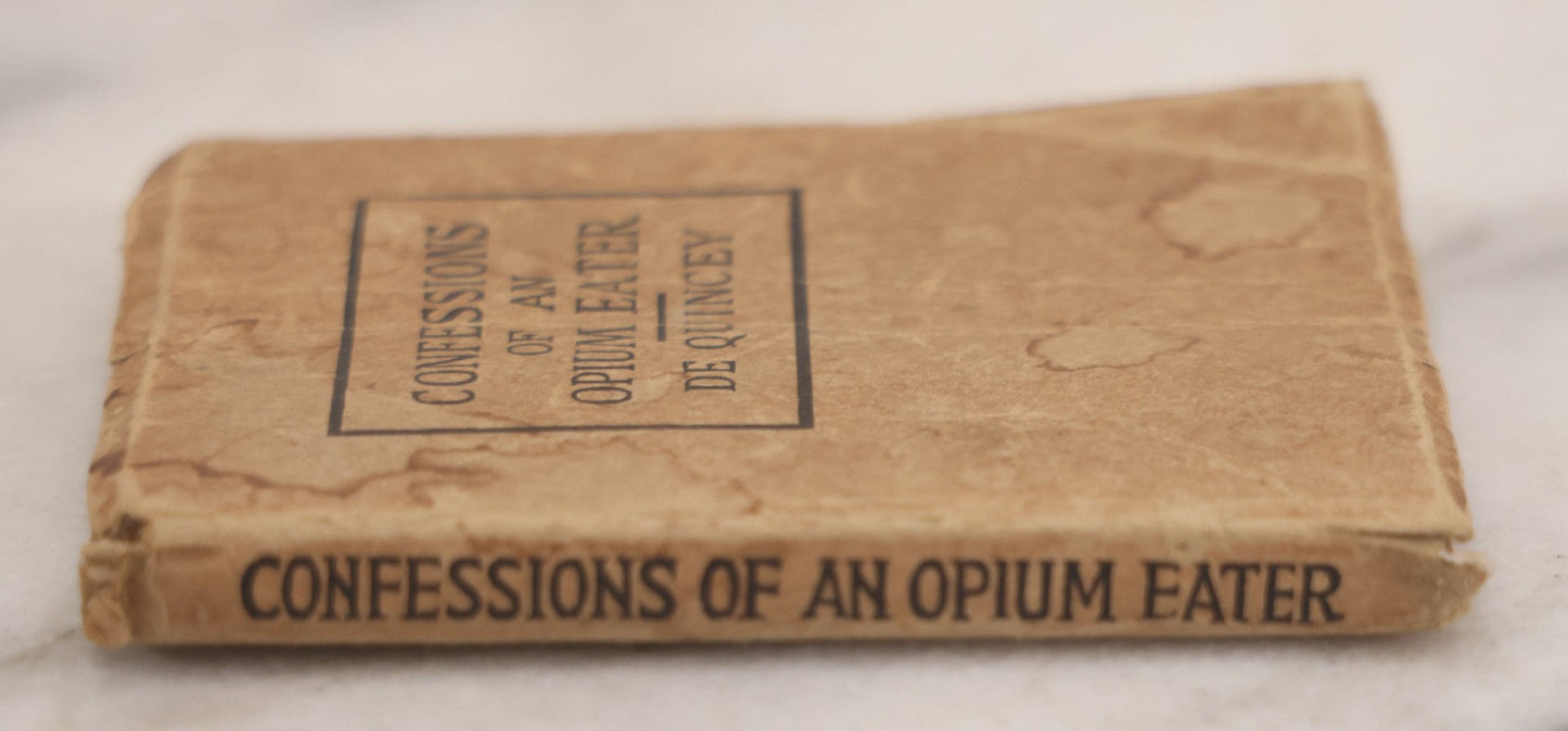 Lot 041 - Grouping Of Two Miniature Narrow Clear Glass Bottles And "Confessions Of An Opium Eater" Antique Miniature Book With Paper Cover And Advertising For Whitman's Candy In Rear, Published By Little Leather Library Corporation, New York, Circa 1920