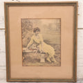 Lot 058 - Antique Framed Hand-Tinted Art Photo Print, "Where Loveliness Keeps Tryst," Featuring Woman In Yellow Dress On Bench With Flowers, Copyright O. Co., 11-1/2" x 13"