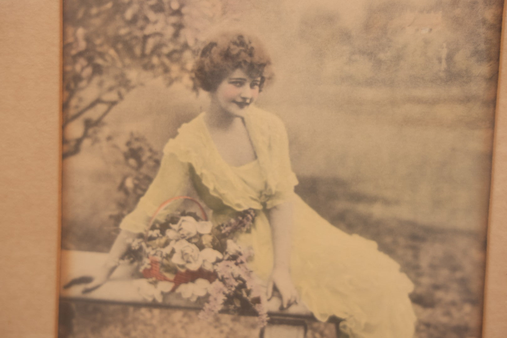 Lot 058 - Antique Framed Hand-Tinted Art Photo Print, "Where Loveliness Keeps Tryst," Featuring Woman In Yellow Dress On Bench With Flowers, Copyright O. Co., 11-1/2" x 13"