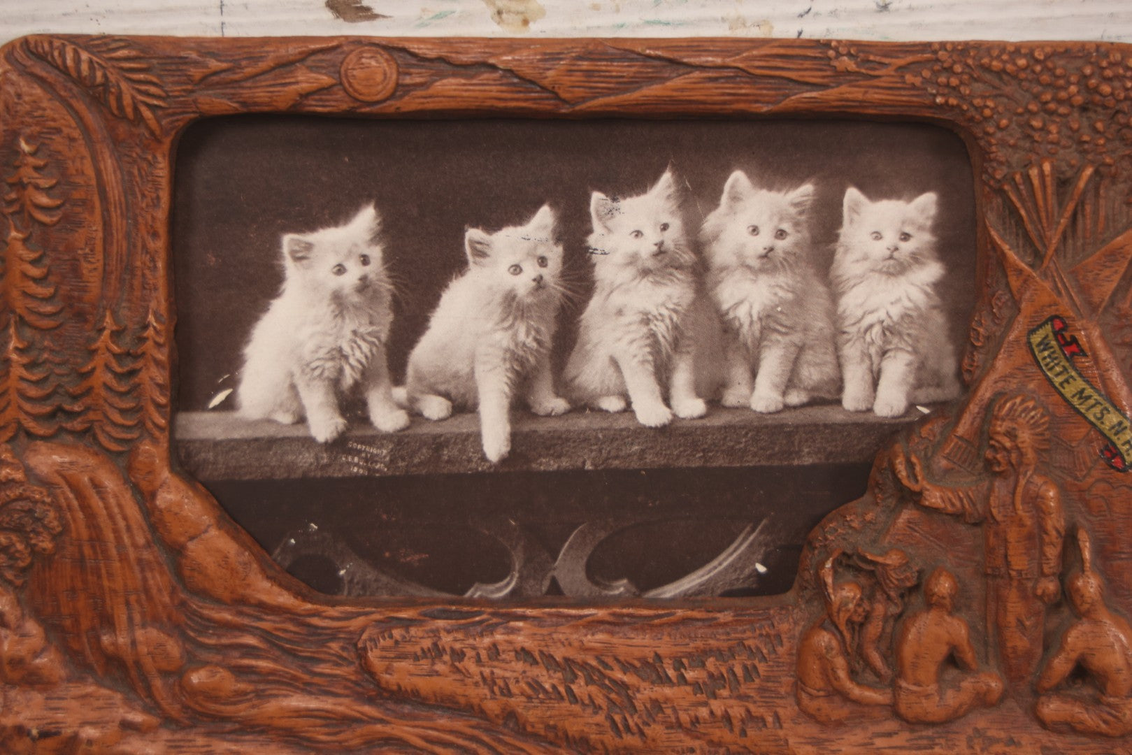 Lot 064 - Antique Molded Composite Photo Frame With Native American Motif, Souvenir Of White Mountains, New Hampshire, With Black And White Photo Postcard Of Five Kittens, 7-3/8" x 4-5/8"