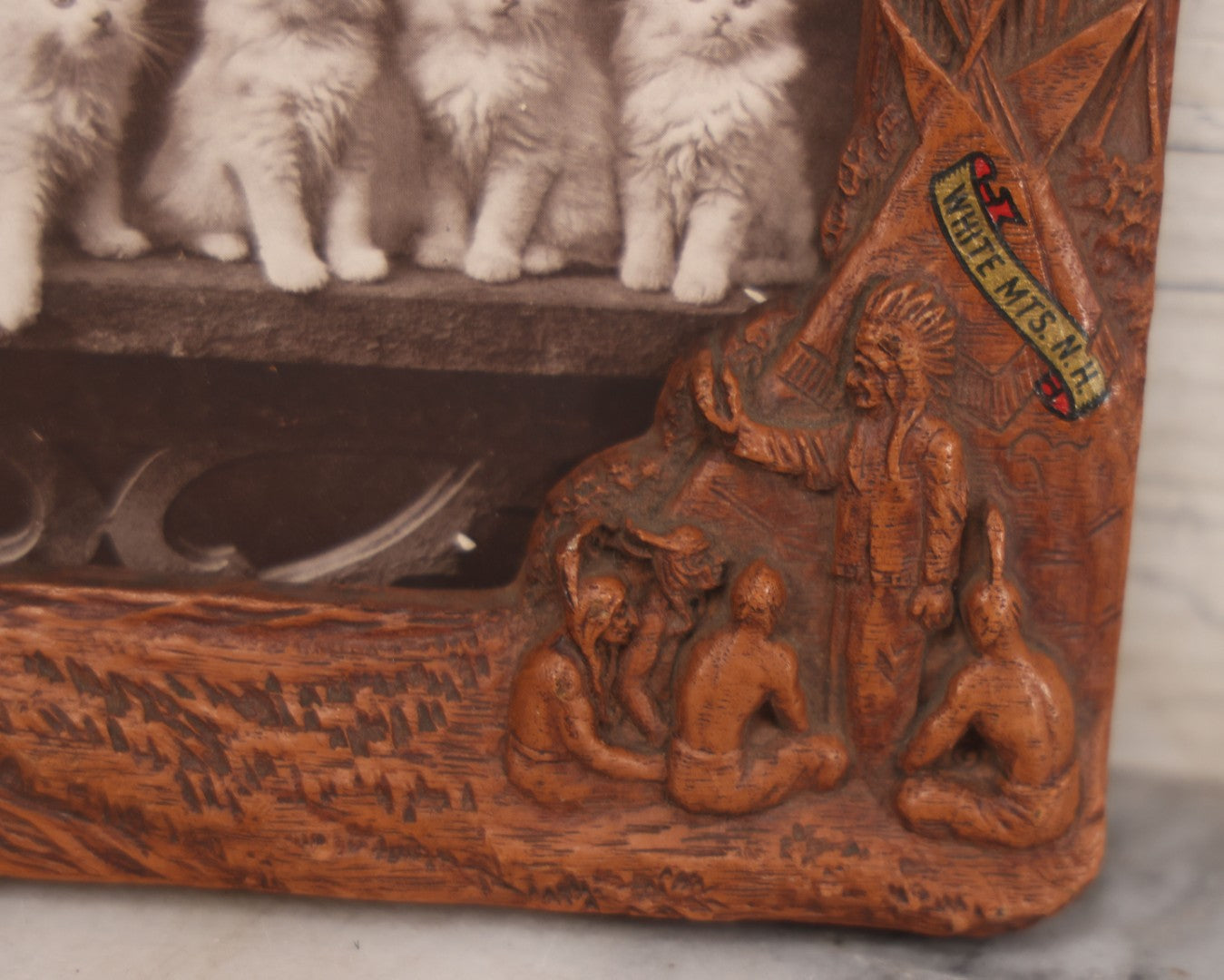 Lot 064 - Antique Molded Composite Photo Frame With Native American Motif, Souvenir Of White Mountains, New Hampshire, With Black And White Photo Postcard Of Five Kittens, 7-3/8" x 4-5/8"