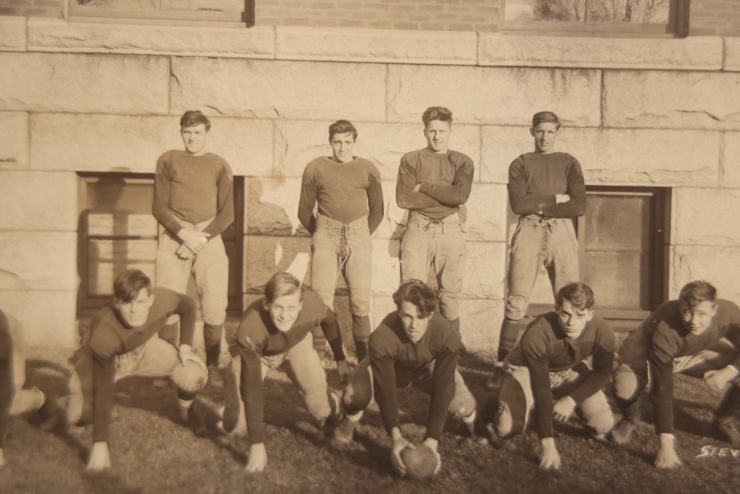 Lot 065 - Vintage Paper Framed Glossy Black And White Photo Of North Dakota State College Football Team, 1937, Featuring Jack Stevens
