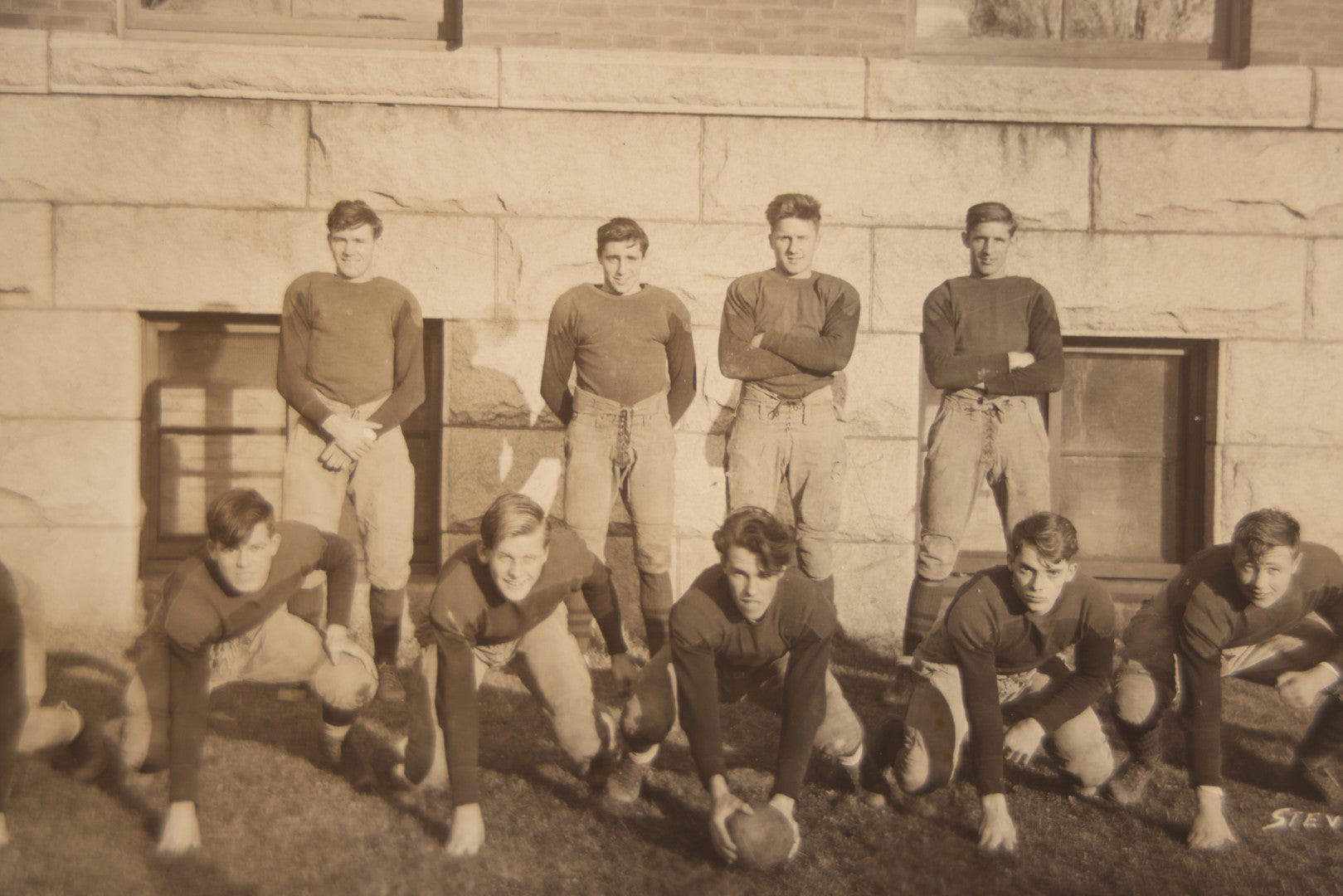 Lot 065 - Vintage Paper Framed Glossy Black And White Photo Of North Dakota State College Football Team, 1937, Featuring Jack Stevens