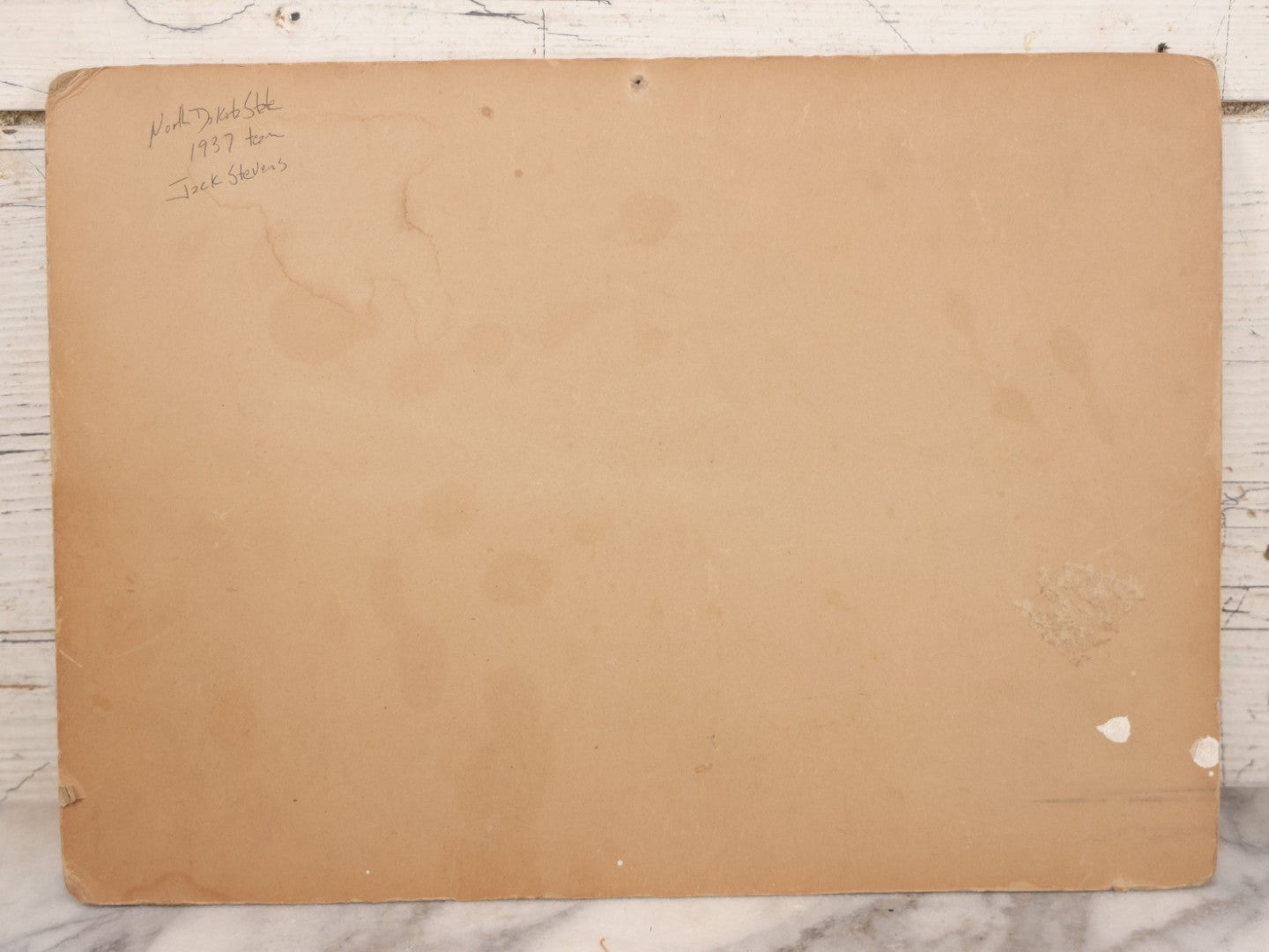 Lot 065 - Vintage Paper Framed Glossy Black And White Photo Of North Dakota State College Football Team, 1937, Featuring Jack Stevens